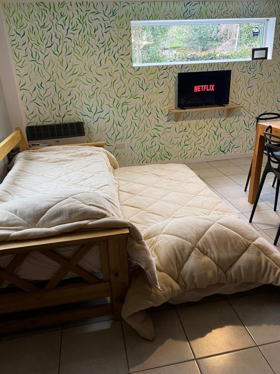 Krevet ili kreveti u jedinici u okviru objekta Departamentos a pasos del centro