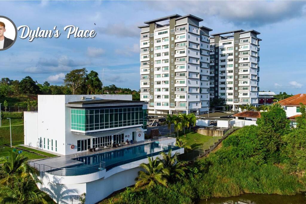 a view of a building with two tall buildings at Pink Studio Serene Heights Condo One bedroom 2 beds & Sofa Bed in Miri