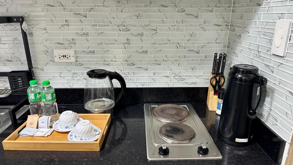 Η κουζίνα ή μικρή κουζίνα στο Mall of Asia Shore 2 Condo