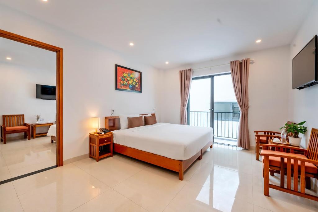Postel nebo postele na pokoji v ubytování Tomorrow Hoi An Villa