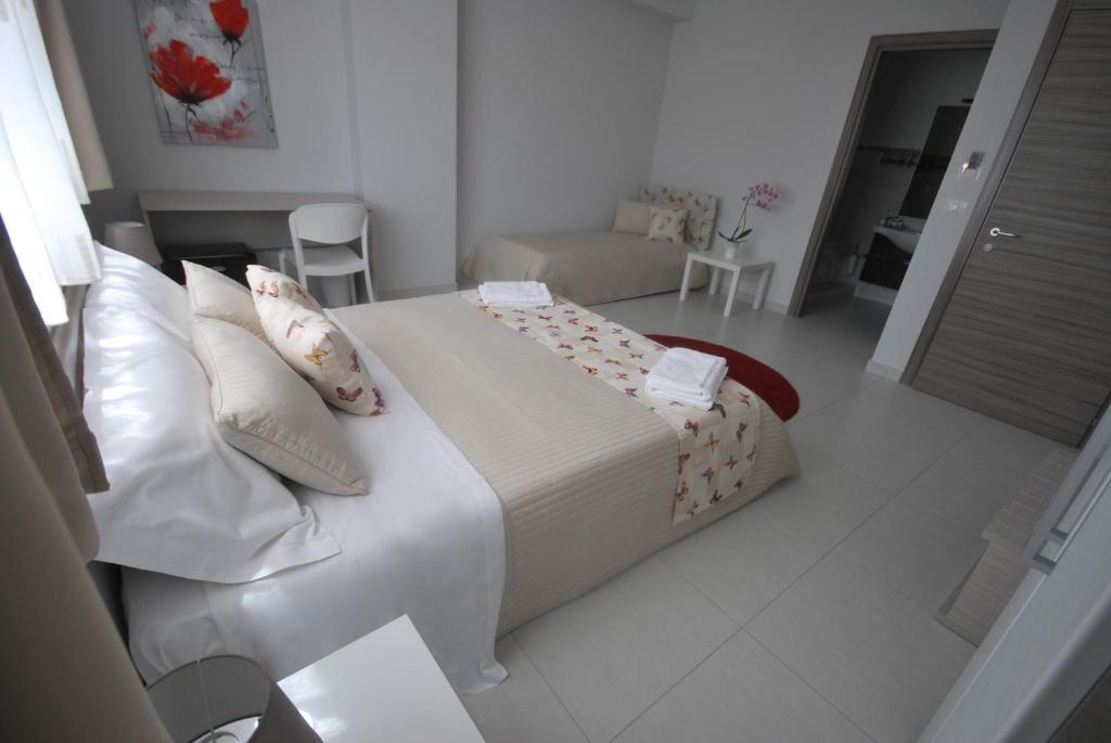 Postel nebo postele na pokoji v ubytování Pietra Bianca Rooms