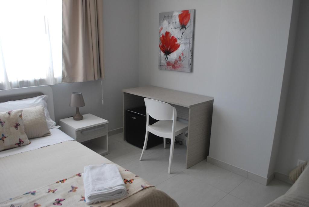 Postel nebo postele na pokoji v ubytování Pietra Bianca Rooms