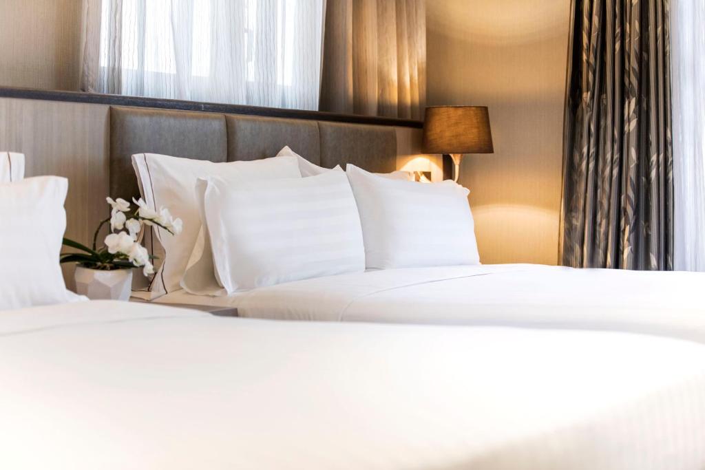 Postel nebo postele na pokoji v ubytování Hotel Valletta