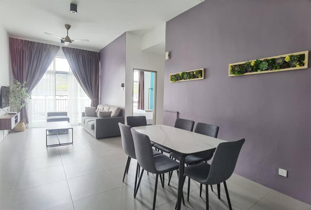 a dining room with a table and chairs in a living room at G Residence - 2R2B Barrington Night Market (1) in Brinchang