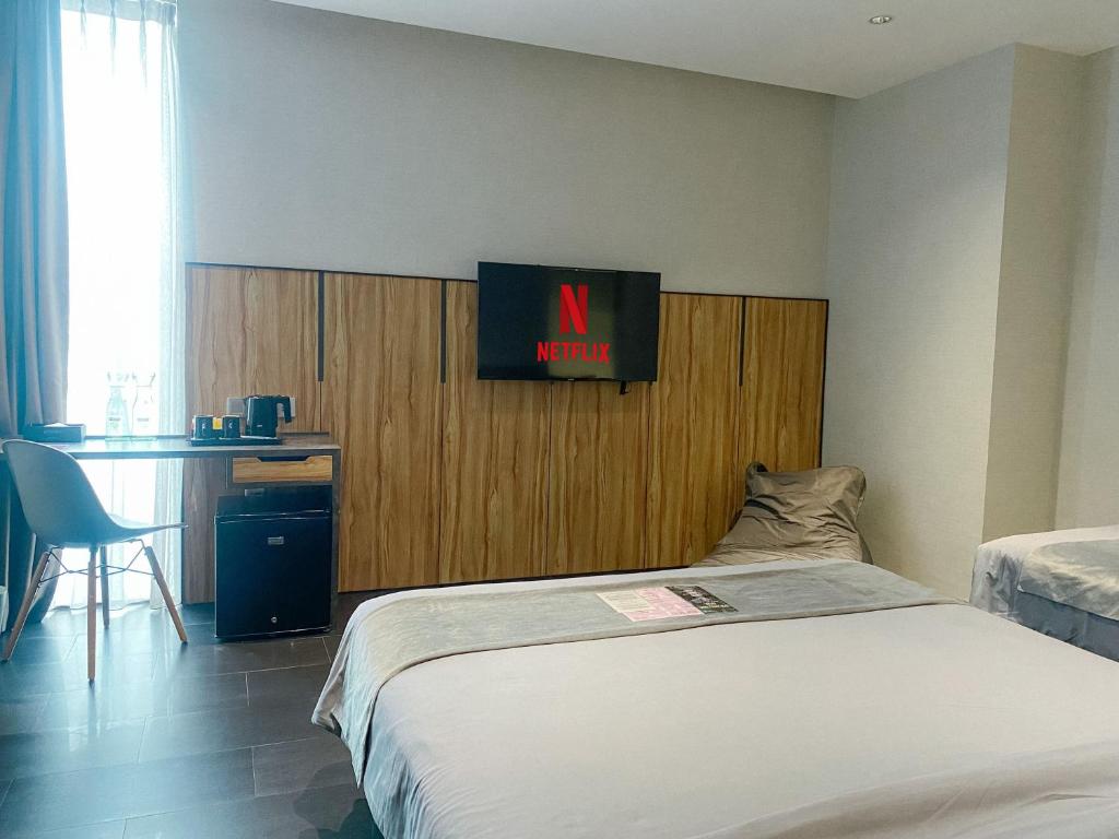 Postel nebo postele na pokoji v ubytování Erian Hotel