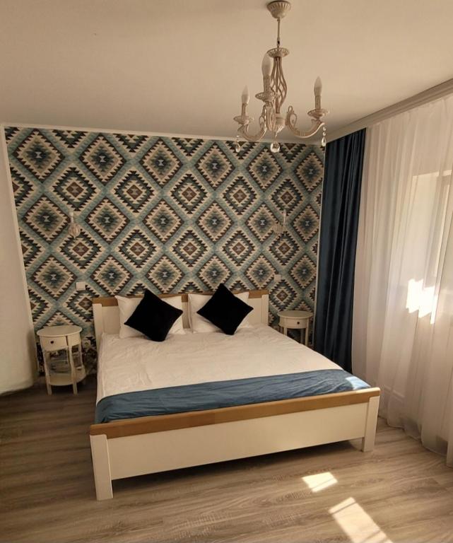 Postel nebo postele na pokoji v ubytování Casa Domnească