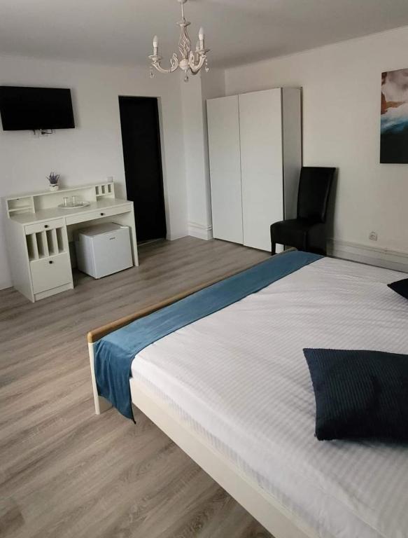 Postel nebo postele na pokoji v ubytování Casa Domnească