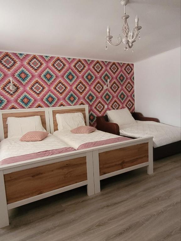 Postel nebo postele na pokoji v ubytování Casa Domnească
