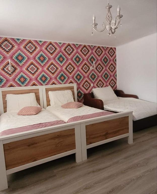 Postel nebo postele na pokoji v ubytování Casa Domnească