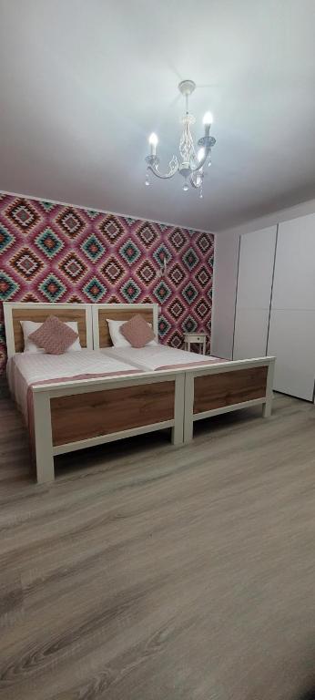 Postel nebo postele na pokoji v ubytování Casa Domnească