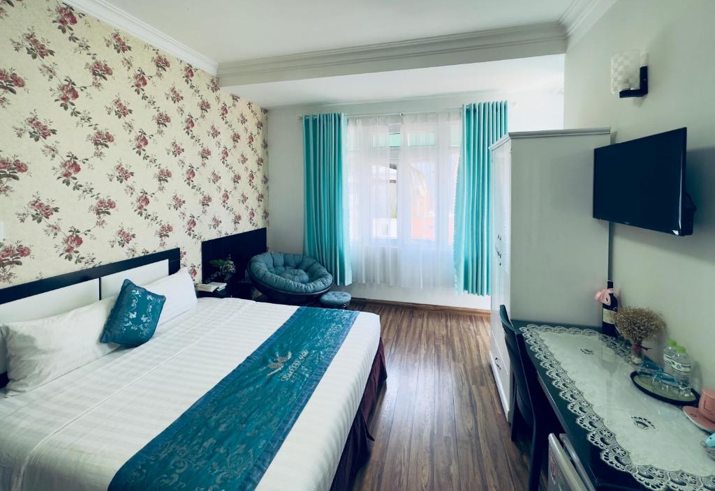 Giường trong phòng chung tại Dalat Eco Hotel