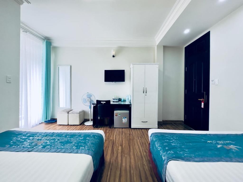 Giường trong phòng chung tại Dalat Eco Hotel