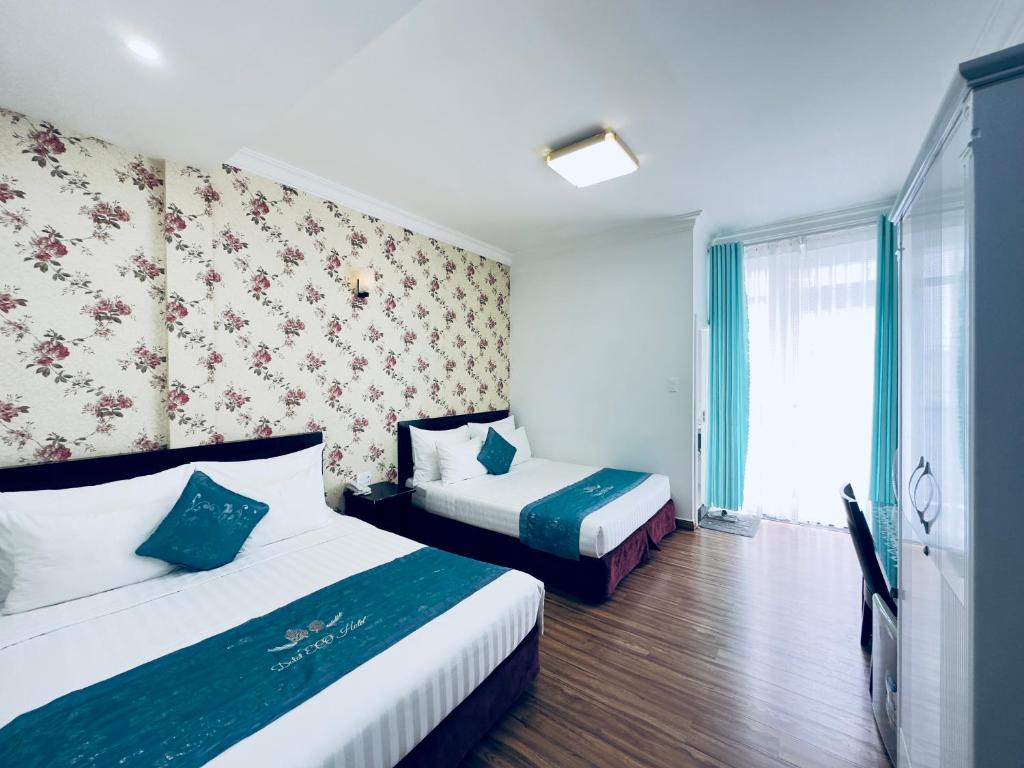 Giường trong phòng chung tại Dalat Eco Hotel