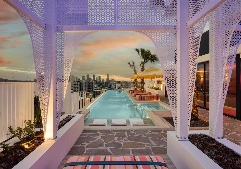 a swimming pool on the roof of a building at Rambla at South City SQ in Brisbane