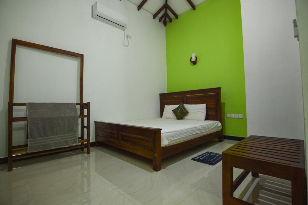 Postel nebo postele na pokoji v ubytování Binara Home Stay