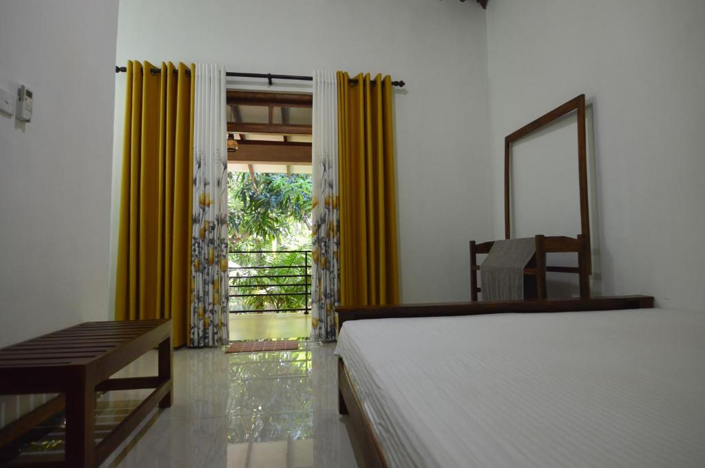Postel nebo postele na pokoji v ubytování Binara Home Stay