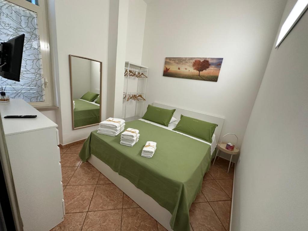 Säng eller sängar i ett rum på Appartamento Cataleya Home