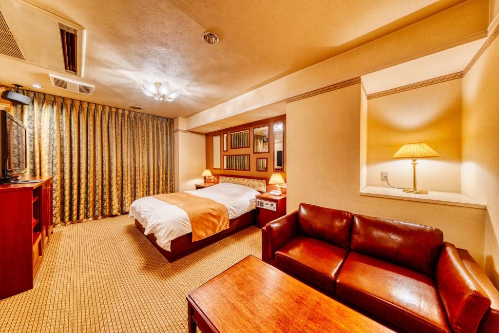 Postel nebo postele na pokoji v ubytování HOTEL LITZ HIROSHIMA -Adult Only
