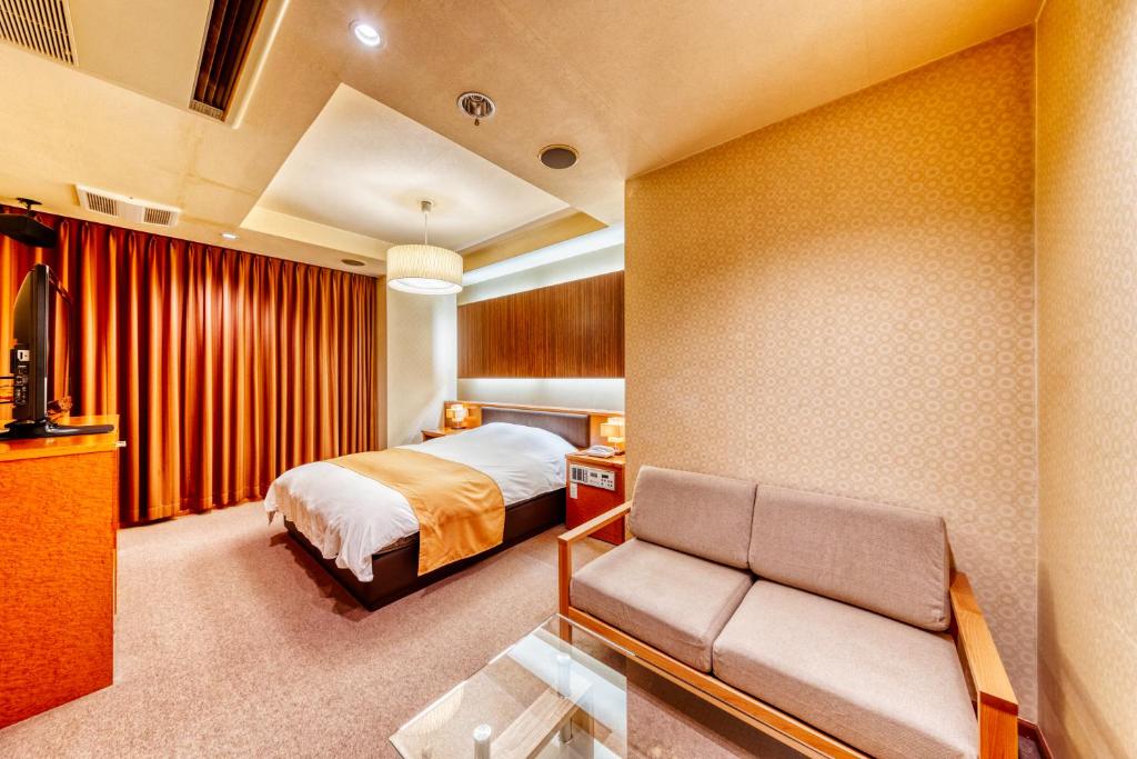 Postel nebo postele na pokoji v ubytování HOTEL LITZ HIROSHIMA -Adult Only