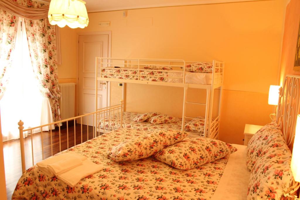 Postel nebo postele na pokoji v ubytování B&B il Castello