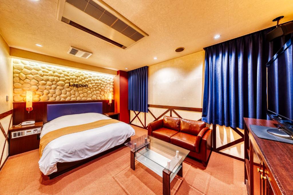 Postel nebo postele na pokoji v ubytování HOTEL LITZ HIROSHIMA -Adult Only