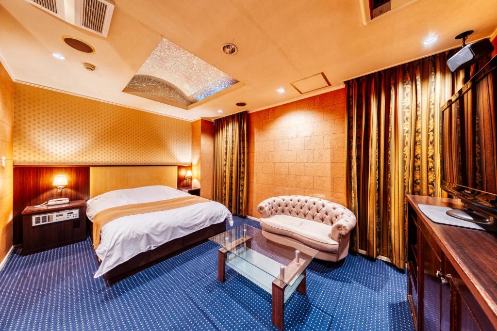 Postel nebo postele na pokoji v ubytování HOTEL LITZ HIROSHIMA -Adult Only