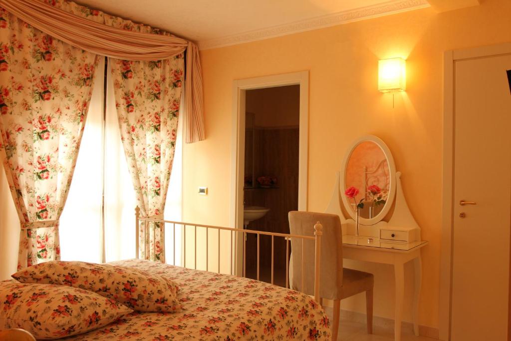 Postel nebo postele na pokoji v ubytování B&B il Castello