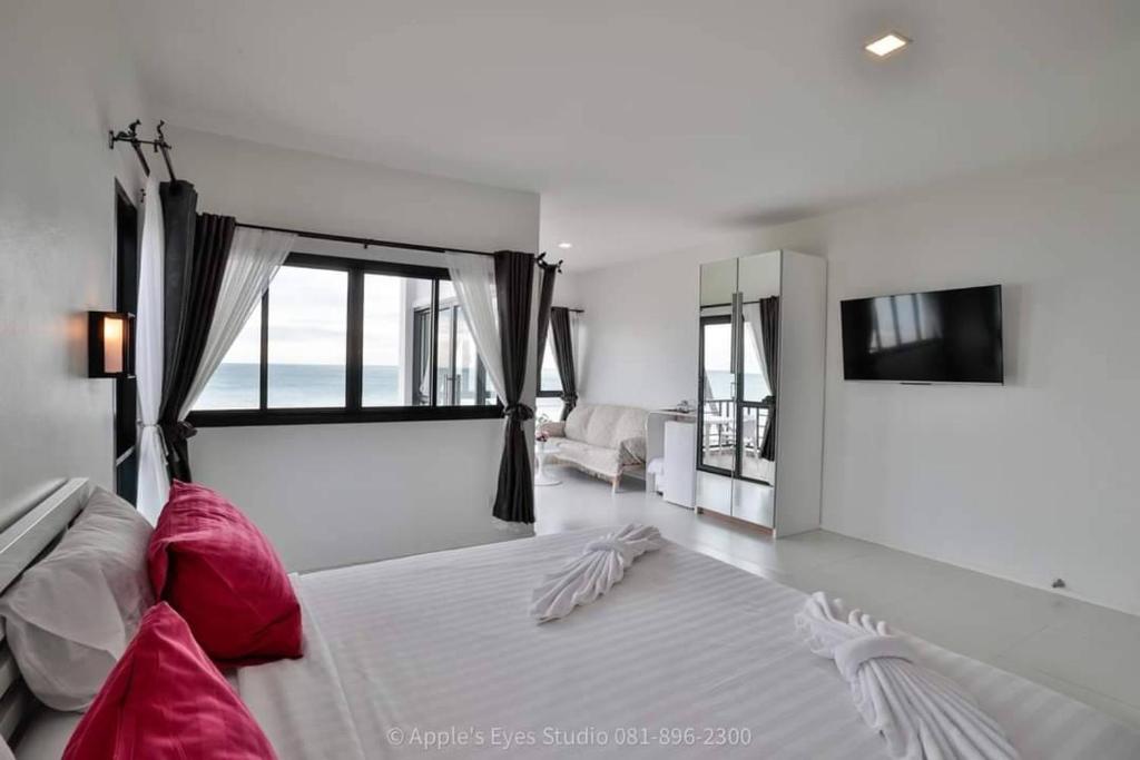 Postel nebo postele na pokoji v ubytování Cozy Khanom โคซี่ ขนอม