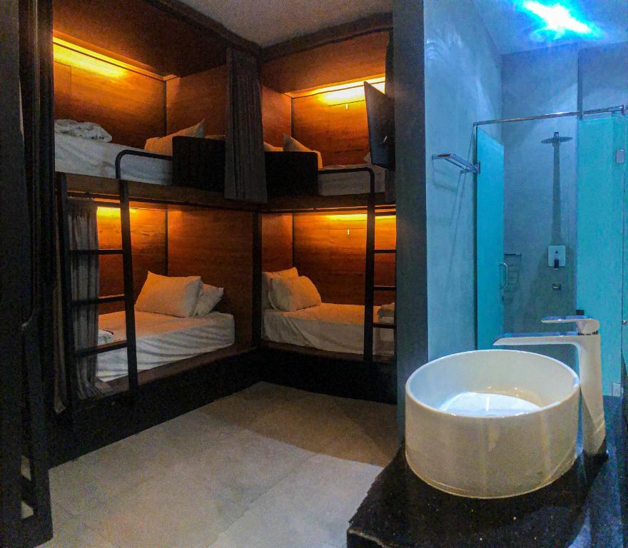 Postel nebo postele na pokoji v ubytování Hotel Dafam Wonosobo