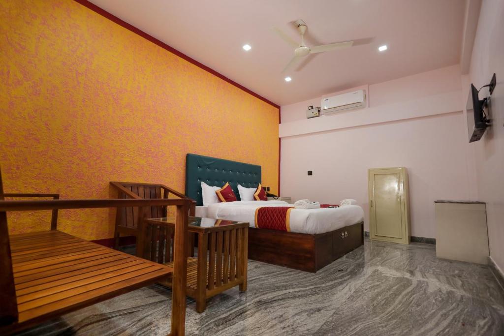 Postel nebo postele na pokoji v ubytování Hotel Wayanad Stay