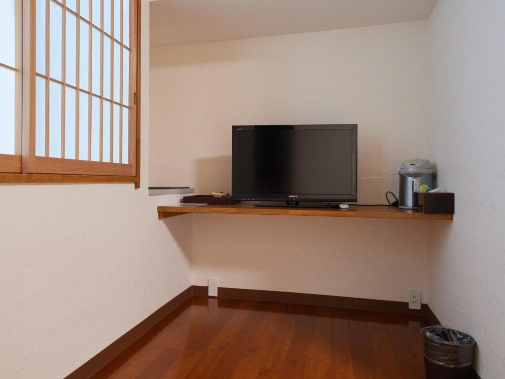 TV a/nebo společenská místnost v ubytování Sakura no Yakata Hotel