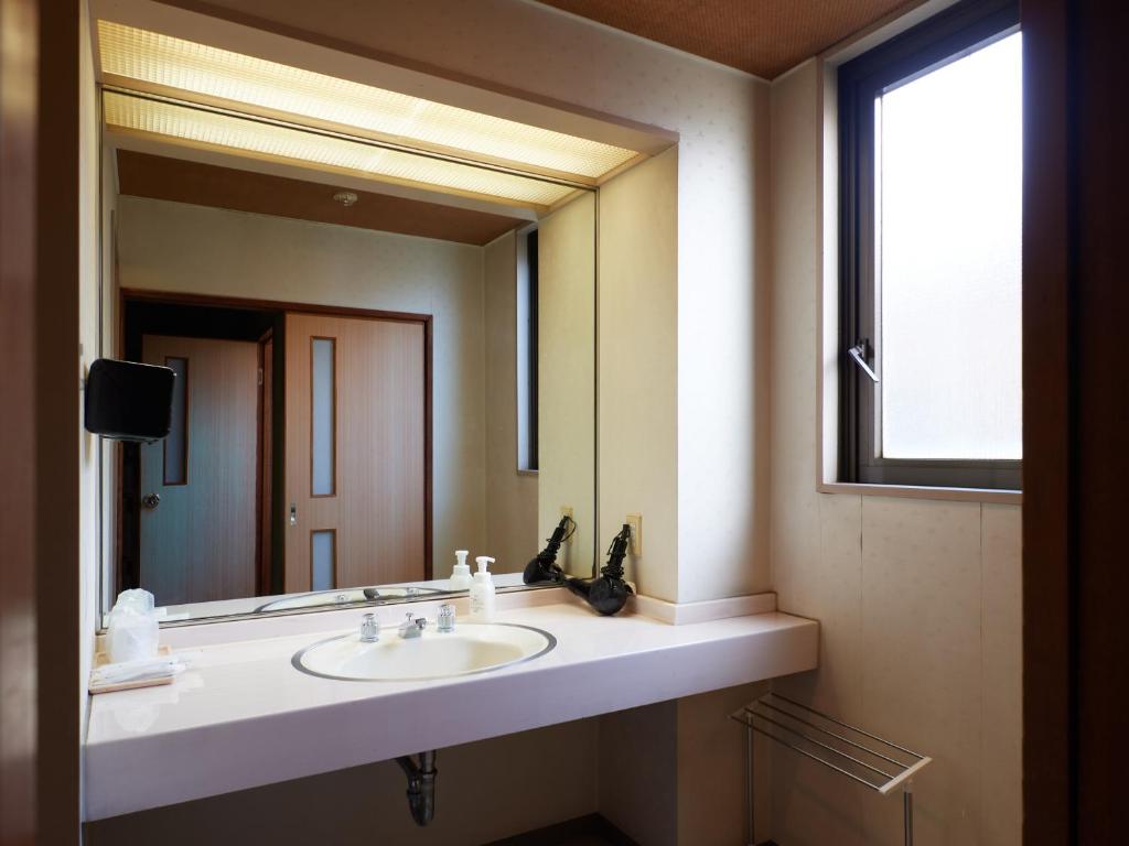 Koupelna v ubytování Sakura no Yakata Hotel