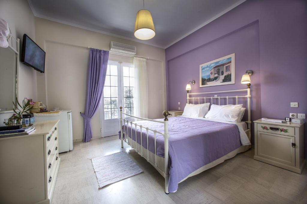 Postel nebo postele na pokoji v ubytování Vassilis Guest House