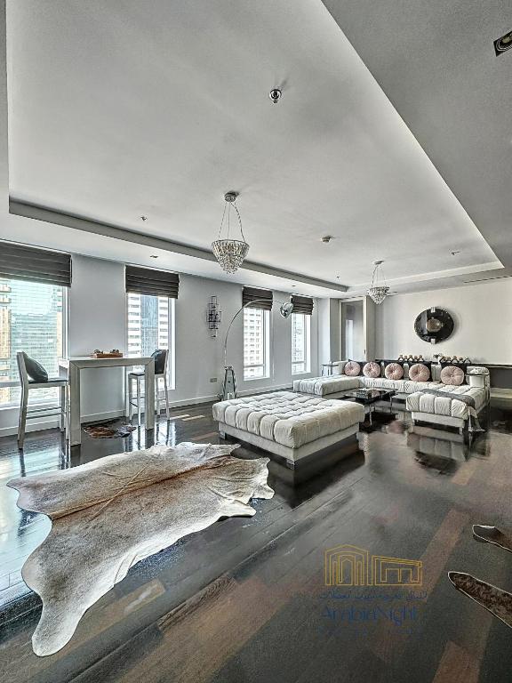 a large living room with a couch and a table at La Casa By Arabian Nights - City View - Bespoke Design in Dubai