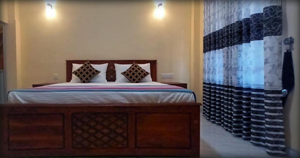 Postel nebo postele na pokoji v ubytování Sigiri Arana Sigiriya
