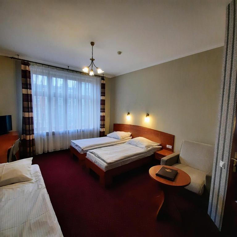 Posteľ alebo postele v izbe v ubytovaní Hotel Kazimierz II