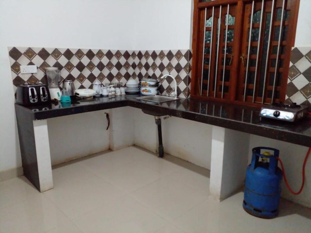 a table in a room with a counter top at Minsara Villa in Hikkaduwa