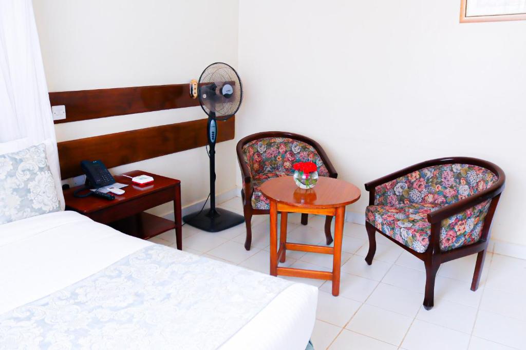 Postel nebo postele na pokoji v ubytování Sportsview Hotel Kasarani