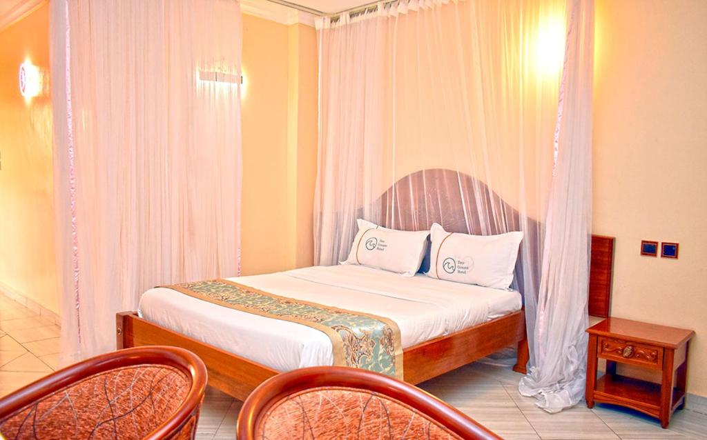 Postel nebo postele na pokoji v ubytování Two Oceans Hotel Voi