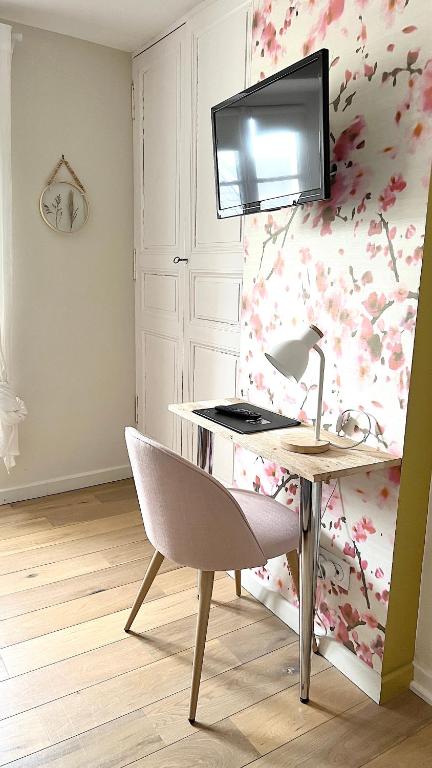 Televízia a/alebo spoločenská miestnosť v ubytovaní Appartement Bossoreil 110m2 - 3 chambres