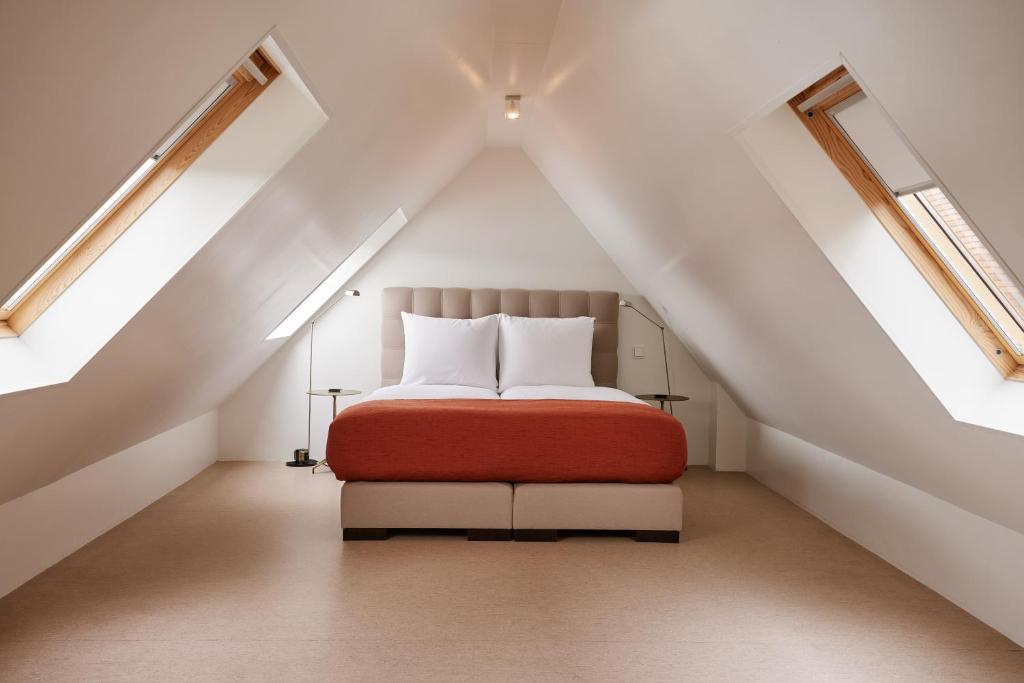Postel nebo postele na pokoji v ubytování Hotel Miss Blanche