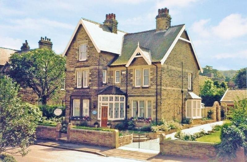a large brick house with at Braemar Guest House in Buxton