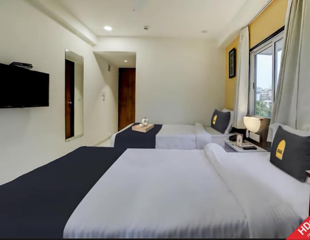 Postel nebo postele na pokoji v ubytování Leo Hotel