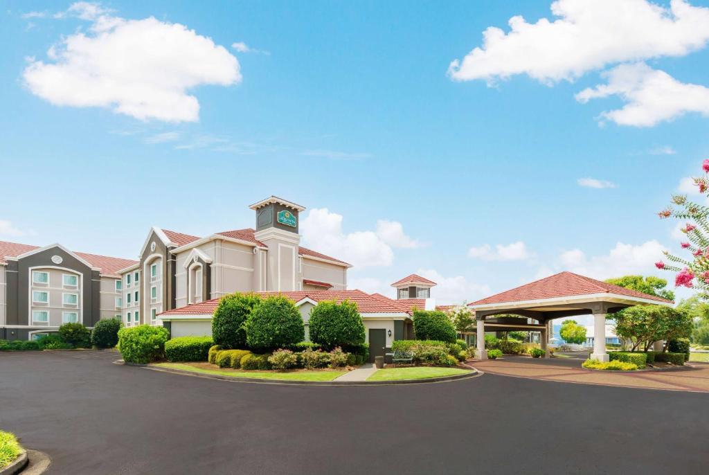 a building with a clock tower on top of it at La Quinta by Wyndham Myrtle Beach Broadway Area in Myrtle Beach