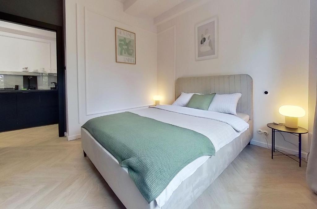 Postel nebo postele na pokoji v ubytování Apartament na Grochowej Centrum