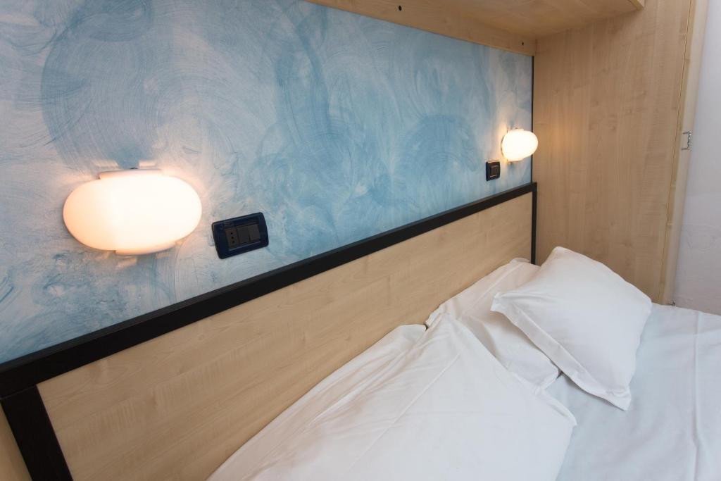 Postel nebo postele na pokoji v ubytování Hotel New Castle