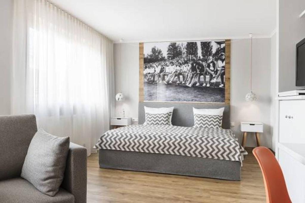 TV a/nebo společenská místnost v ubytování Hotel HerzogsPark