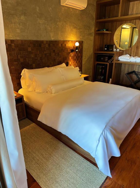 Cama ou camas em um quarto em Duke Beach Hotel Maresias