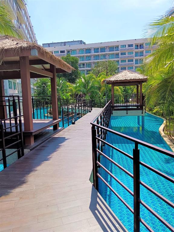 a resort swimming pool with a gazebo and a building at Laguna Beach Resort 3 Maldives in Jomtien Beach