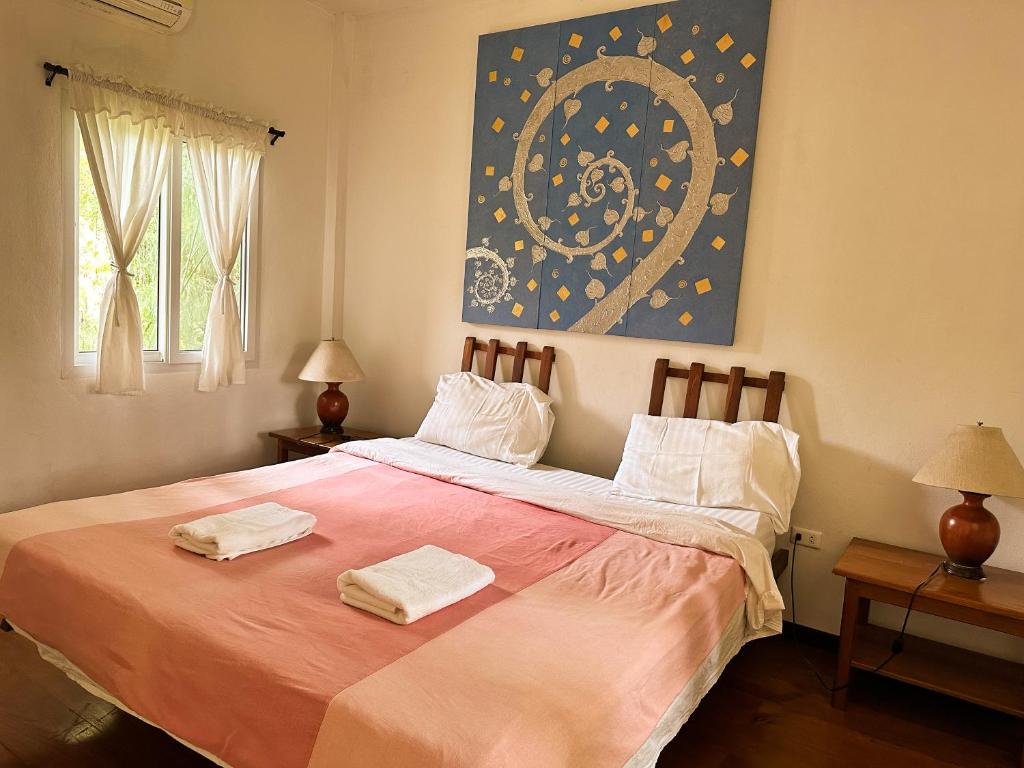 Postel nebo postele na pokoji v ubytování Pairadise Hotel